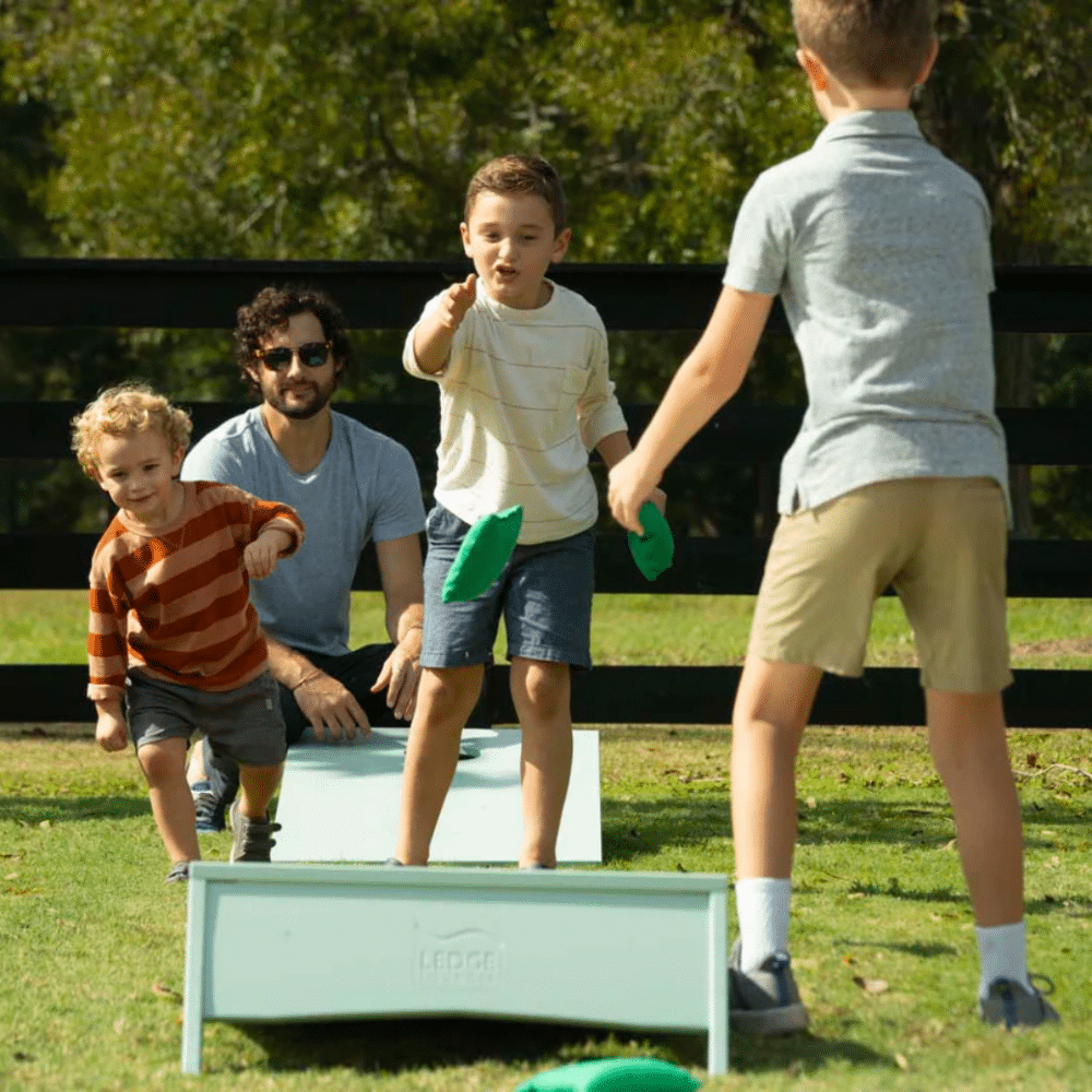 Ledge Lounger Cornhole Toss Lime Lifestyle Image 1