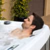 LS600DX-Arctic-White-Coastal_Gray-Lifestyle-Man_Lounge